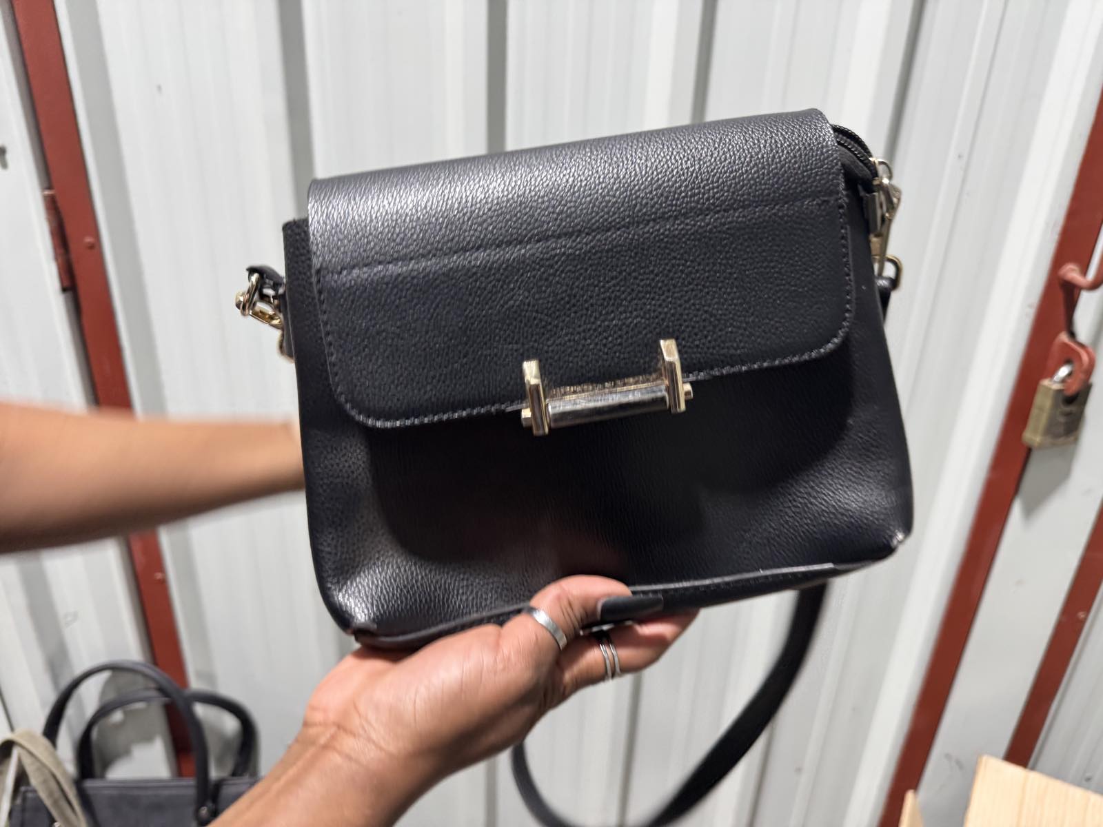 Black Crossbody Bag with Gold Bar Clasp